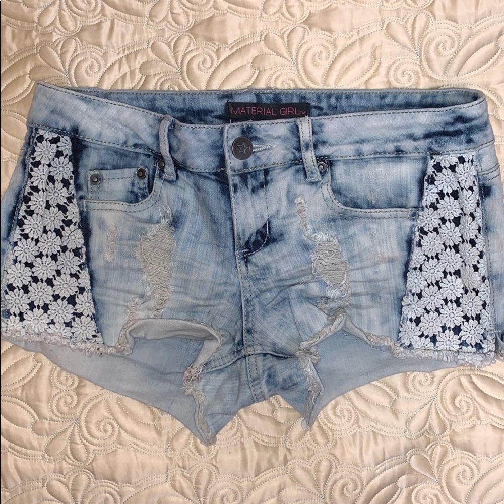 Blue shorts with cool designs and rips!
